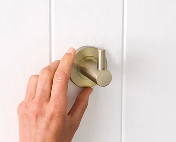 What is the difference between a towel hook and a robe hook?
